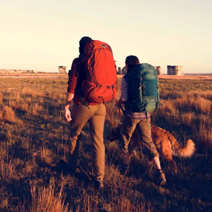 couple hiking together with dog